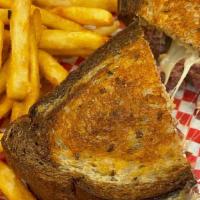 Reuben · Grilled corned beef or turkey served on marble rye with sauerkraut, melted swiss cheese, and...