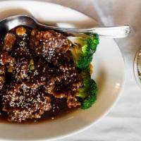 Sesame Beef · Crispy chunks of beef in a caramel brown sauce. served with steamed white rice.