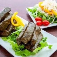 Beef Grape Leaves Appetizer · Rolled stuffed with beef and rice served with tzatziki sauce and pita bread.
