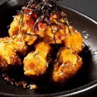 Chicken Karaage · Lightly battered boneless chicken marinated with fresh ginger juice served with Japanese spi...