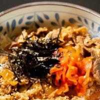 Gyudon · Marinated sliced beef and caramelized onion served with a scallions nori red carrot and naru...