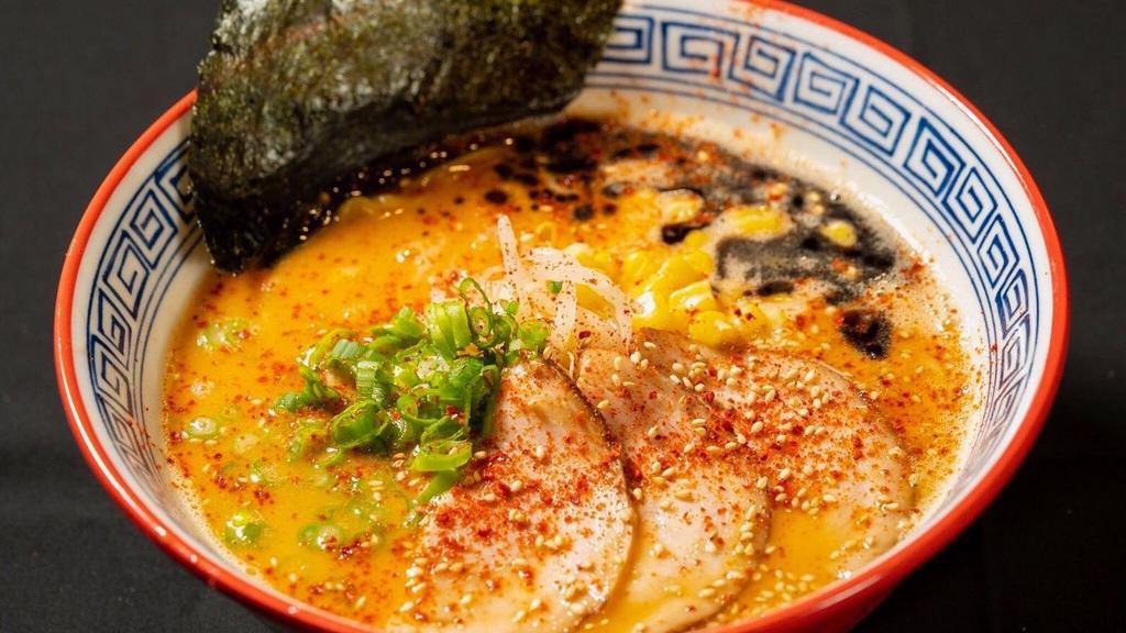 Spicy Miso Ramen · Tonkotsu broth spiked with our Savory red sauce & miso base served with scallions, bean sprouts, sweet corn & pork char slu, black garlic oil.