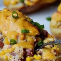 Stuffed Potato Skins · With bacon and shredded cheddar cheese.