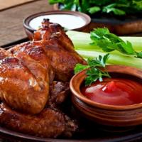 Barbeque Whole Wings · Marinated and glazed with our special Moonshine Barbeque Sauce. Keep some wet napkins close ...