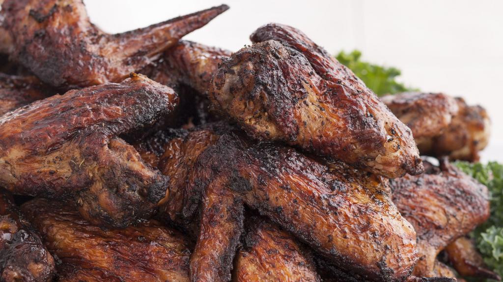 Jerk Wings · Seasoned and marinated overnight using traditional Walkerswood Jerk Seasoning. Definitely will light up your taste buds! Get it roasted or grilled.