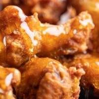 Honey Mustard Wings · Crispy, golden, fried wings glazed with sweet and tangy honey mustard sauce.