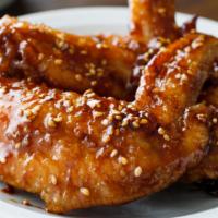 Teriyaki Wings · Crispy, golden, fried wings glazed with a sweet, soy-based sauce.