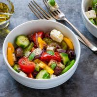 Greek Salad With Chicken · Tender, grilled chicken on a bed of fresh
tomatoes, cucumbers, onion with feta cheese, and o...