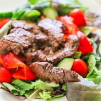 Greek Salad With Steak Tips · Juicy, grilled beef tips on a bed of fresh tomatoes, cucumbers, onion with feta cheese, and ...