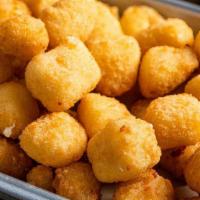 Cheese Curds · Wisconsin white cheddar cheese curds. Breaded and deep-fried.