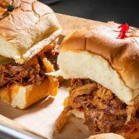 S&B Sloppy Cue Sliders · Blend of our smoked beef and pork, slow-cooked with onions, red bell peppers, and our secret...