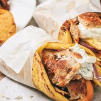 Gyro · Your choice of protein with tomato, onion, and tzatziki sauce. Wrapped in pita.