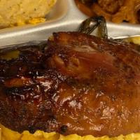 Turkey Wings  Smothered In Gravy Over  Yellow Rice · Includes 2 sides and a dinner roll