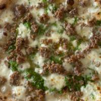 Philly Special Pizza · Provolone, fresh mozzarella, sausage, and spinach pesto.