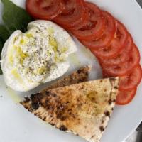 Caprese Salad · Burrata, sliced tomatoes, basil, extra virgin olive oil and cracked pepper. Served with bread.