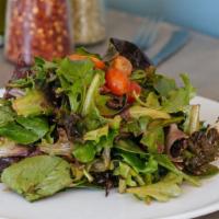 Giardino Salad · Spring mix, cherry tomatoes, kalamata olives, and house vinaigrette. Served with bread.