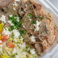 Gyro Or Chicken Gyro Bowl · A bed of Greek lettuce and rice topped with our delicious thinly sliced gyro meat, feta chee...