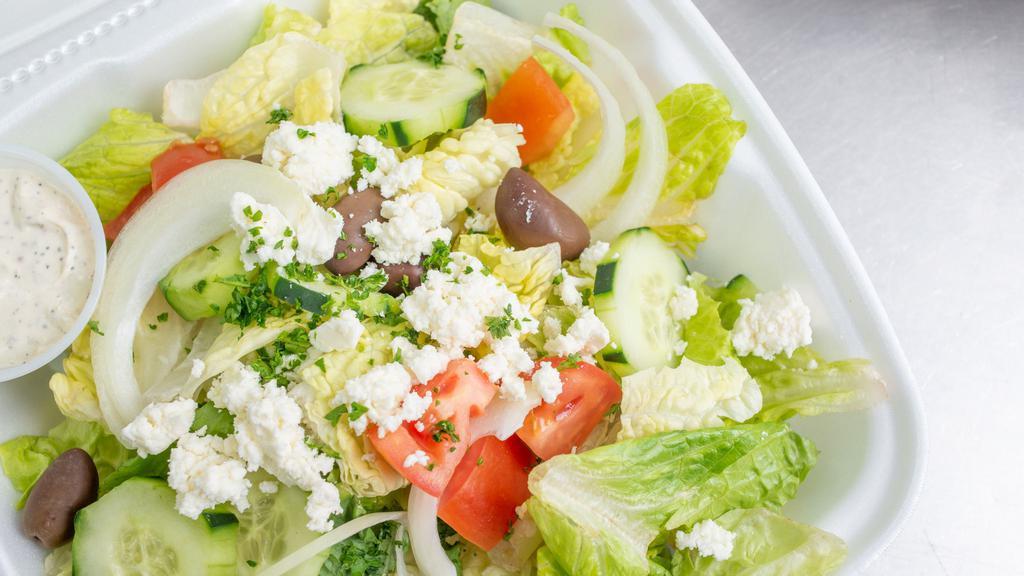 Greek Salad · Spicy. Lettuce greens with tomatoes, cucumbers, banana peppers, kalamata olives, feta cheese, and onions served in our house dressing with pita bread.