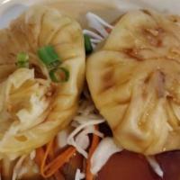 Thai Dumplings (Steamed) · Steamed dumplings filled with ground pork, water chestnuts, shiitake mushrooms, and served w...
