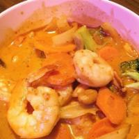 Massaman Curry · Spicy. Your choice of chicken, beef, or shrimp in a rich red curry and peanut sauce with coc...