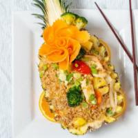 Pineapple Fried Rice  · Thai style stir-fried jasmine rice with egg, chicken, onions, carrots, bell peppers, broccol...