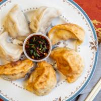 Peking Ravioli · Pork Dumplings served steamed or fried with a homemade scallion-ginger sauce