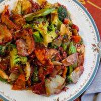 Hunan Pork · Slow roasted pork with seasonal vegetables in a spicy Asian black bean sauce.