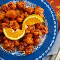 Orange Chicken · Orange flavored chicken served crispy and tender and a sweet and slightly spicy sauce.