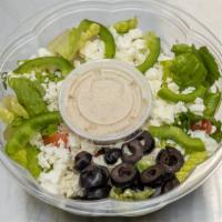 Greek Salad · Lettuce, feta, tomatoes, cucumbers, onions, green peppers, Greek dressing.