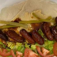 Makanek Wrap · Makanek (Lebanese sausages), hummus, lettuce, tomatoes, pickles.