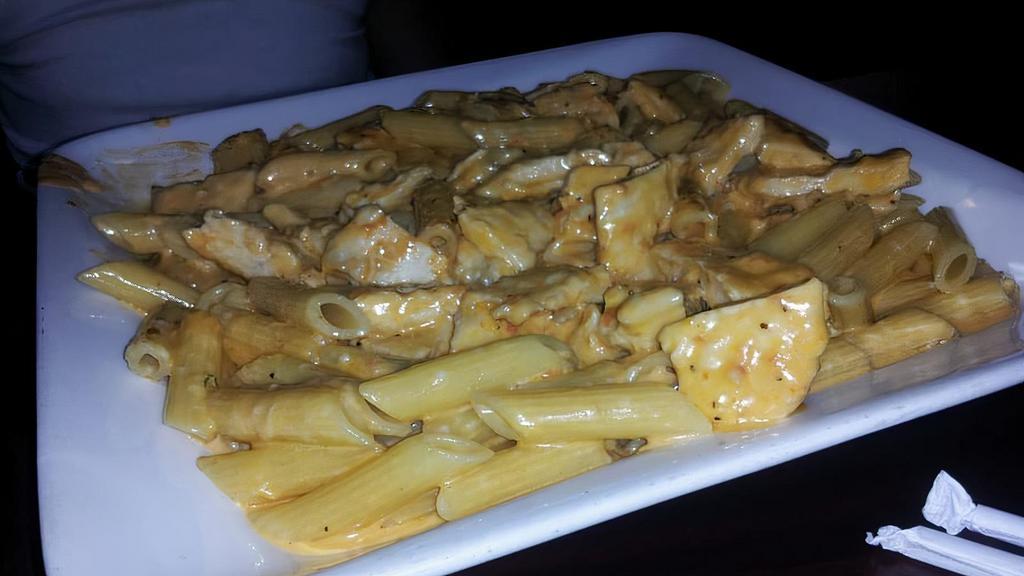 Penne Vodka · Penne pasta tossed with a vodka sauce and topped with grilled chicken.