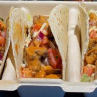 Fire Falls Chicken Tacos · Chicken, Sweet Ancho Chipotle Sauce, Shredded Cheddar Cheese, Lettuce, Pico de Gallo, with a...