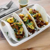 Tacos Al Pastor · Thin Strips of Pork Marinated in our Guajillo Salsa and Pineapple, served with Fresh Chopped...