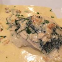 Stuffed Filet Of Flounder · With spinach and crabmeat, served with mashed potatoes with a lemon-leblane sauce.