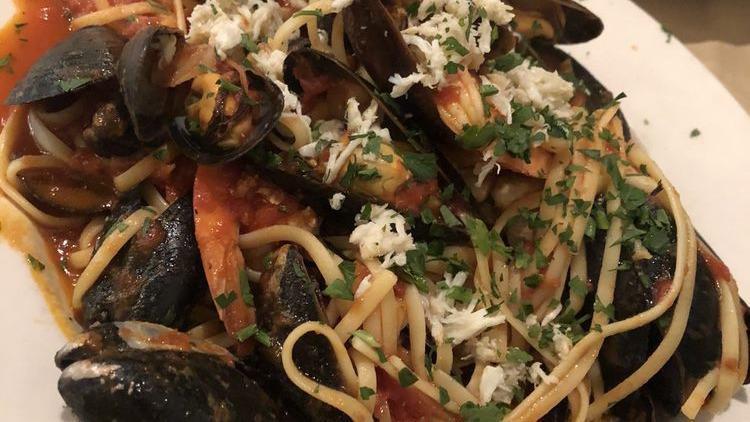 Linguine Pescatore'  · served with mussels, clams, shrimp, crab meat with white sauce OR  plum tomato sauce olive oil, garlic and spices.