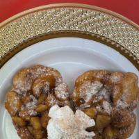 Apple Deluxe · Funnel cake with fresh cinnamon sugar apples including caramel topping.
**Whipped topping in...
