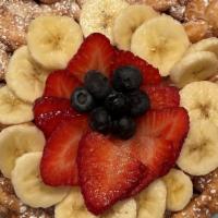 Fruit Lover'S Special · Traditional funnel cake with plain powdered sugar, topped with fresh bananas, strawberries, ...