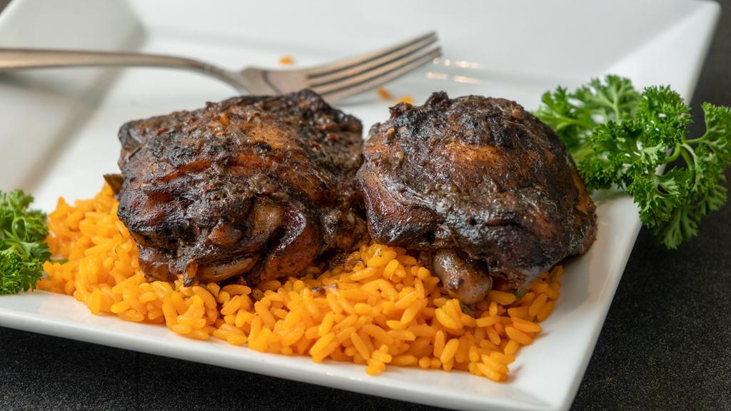 Jerk Chicken Over Rice · 2 Drumsticks slow cooked to perfection. Served over yellow rice