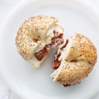 Bagel With Cream Cheese & Bacon · Boiled and baked round bread roll. soft mild cheese. cured pork.