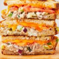 Tuna Melt Sandwich · Classic tuna salad with melted american and sliced tomato on your choice of bread. 9 inch sub.