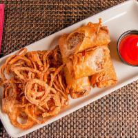 Cheesesteak Egg Rolls · Served with sriracha ketchup and onion straws.