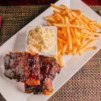 Barbecue Baby Back Ribs · Our special recipe: pork loin braised until tender, brushed with barbecue sauce, served with...