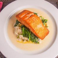 Salmon · Pan seared, served with grilled zucchini risotto and sautéed spinach in a lemon butter sauce.