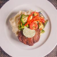 Filet Mignon (8 Oz) · Choice center cut filet topped with garlic and herb butter, served with mashed potatoes and ...