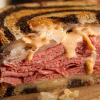 Reuben · Corned beef or patrami with sauerkraut, Swiss cheese and choice of 1000 Island or spicy must...