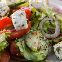 Greek Salad · Romaine lettuce, olives, grape tomatoes, cucumber, onion, banana peppers, feta cheese, orega...