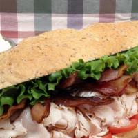 Townie Turkey Club · Oven gold turkey, American cheese, bacon, lettuce, tomato, red onion, and mayonnaise. All sa...