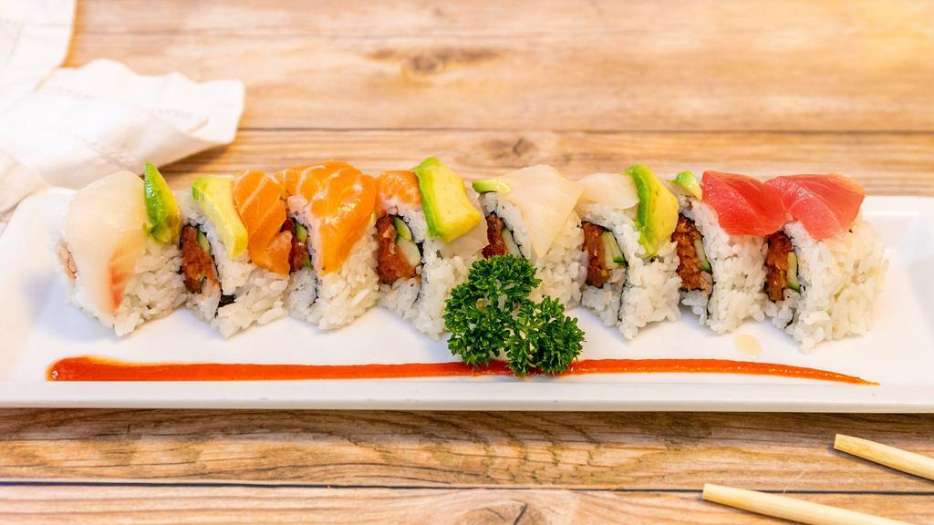 Spicy Rainbow Roll · Spicy. Fresh raw fish. Inside: spicy tuna, cucumber, avocado, tuna, salmon, yellowtail, snapper.