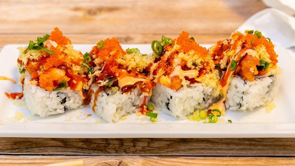 Girl Friend Roll · Spicy. Fresh raw fish. Inside: crab meat, cucumber, avocado, spicy salmon, spicy mayo, tempura flakes on top, sweet sauce, tobiko, green onion.