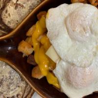 Skillet Breakfasts · A skillet full of panhandled potatoes, your choice of diced ham, bacon, or sausage; with oni...